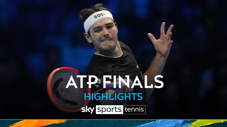 United States' Taylor Fritz returns the ball to Australia's Alex de Minaur during their singles tennis match of the ATP World Tour Finals at the Inalpi Arena, in Turin, Italy, Thursday, Nov. 14, 2024. (AP Photo/Antonio Calanni)